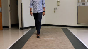 man walking on electronic walkway Montreal General Hospital