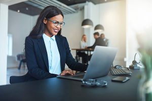 Woman in office seated at computer