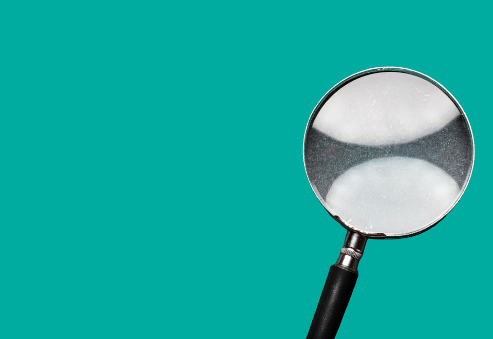 magnifying glass on turquoise background